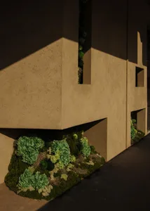 An exterior building facade with modern design elements and green vegetation.