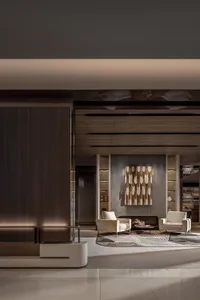 A modern lobby featuring concrete, wood, and metal elements