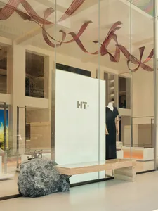 Modern retail storefront featuring glass and stone materials.