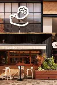 Modern storefront with brick, concrete, and aluminum materials