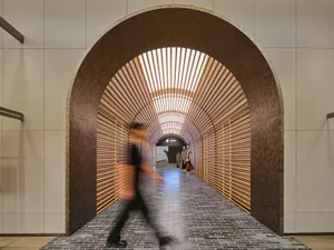 A minimalist tunnel with wooden slats.