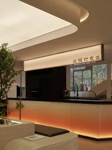 A modern coffee shop with a glass counter showing sleek design features