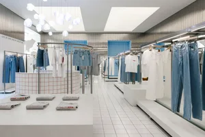 Minimalist retail store with white metal and wood materials