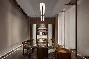 A modern dining room featuring a sleek glass table with wooden benches and chairs, surrounded by minimalist white walls and w