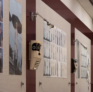 Various fashion designs and layouts on a wall, with lighting and design elements.