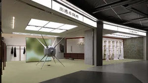 A modern retail installation featuring a futuristic, star-like object and various displays.