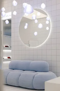 Modern interior featuring fabric, glass, and metal elements