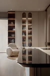 Modern residential library featuring glass shelves and a plush fur chair.