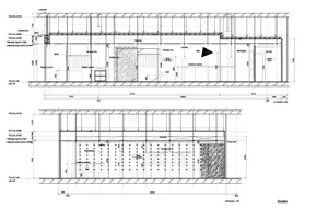 Modern retail layout with display racks, counter, and fitting room