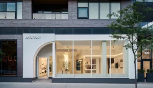 Modern retail storefront with glass windows and a minimalist design.
