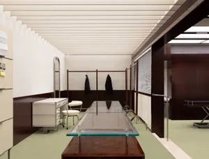 A modern office space featuring glass, metal, and wooden elements.