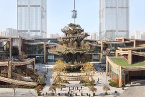 A modern public square with a glass and concrete structure in the center, surrounded by tall buildings and trees.