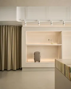 Modern retail storefront featuring minimalist design with light-colored wooden elements.