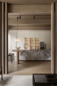 Minimalist kitchen featuring concrete and marble materials.