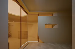 Modern minimalist restaurant featuring glass walls and interior design