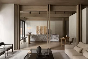 Modern living room with marble accents and high ceiling beams.