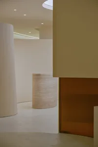 A minimalist interior design space with smooth, matte surfaces and geometric shapes