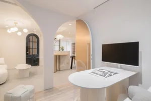 Minimalist modern living room with contemporary furniture and materials.