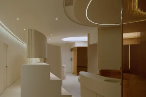 A minimalist restaurant interior with clean lines, white walls, and a sleek, contemporary design.