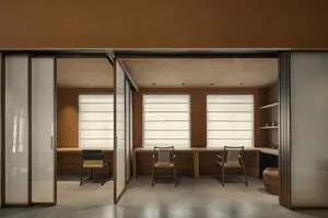 A minimalist office space featuring a combination of wood and glass elements.