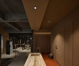 Modern retail storefront featuring concrete and marble materials.