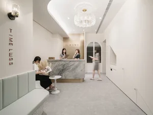 A reception desk made of marble and concrete materials.