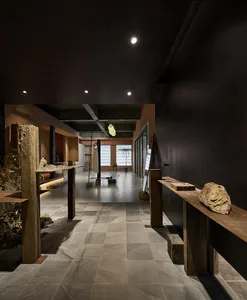 An industrial retail space featuring concrete and glass materials.