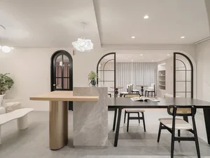 Modern hospitality interior featuring a minimalist design with marble and concrete elements.