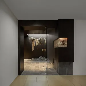 Industrial-style restaurant interior with metal elements and minimalist design.