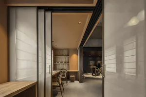 Modern retail storefront with concrete entrance and minimalist interior design