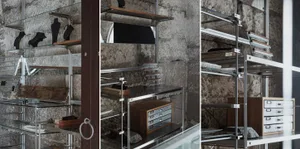 A modern storage shelf with glass and metal components.