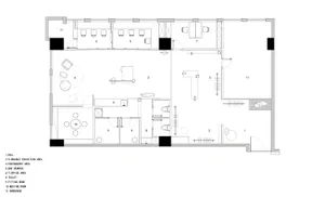 A detailed architectural floor plan of an office building on paper.