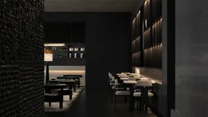 A modern restaurant interior with minimalist design and black concrete walls.