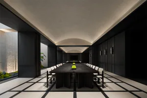 A spacious, modern conference room with a sleek, concrete design.