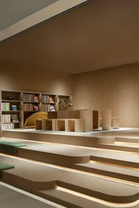 Modern library interior with wooden shelves and steps