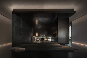 A modern minimalist living room with concrete walls and a central lighting feature.