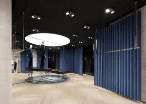 Modern retail shop features a combination of metal, glass, and wood materials.