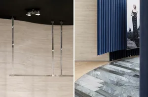 Modern retail storefront with wooden paneled walls and marble floor.
