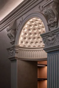 Stone column with ornate detailing in a classic architectural design.