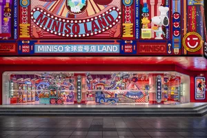 A vibrant and colorful storefront with glass display cases showcasing a variety of products.