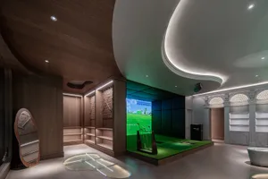 An elegant indoor golf driving range featuring modern design elements.