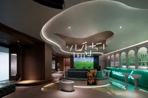 A modern bar and game room with concrete and glass elements.