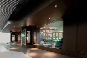 Modern lobby interior with wooden walls and glass partitions