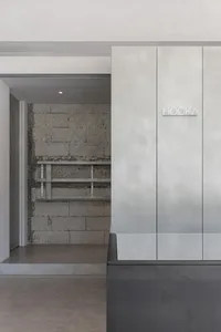 An industrial-style storefront with metallic accents and minimalist design