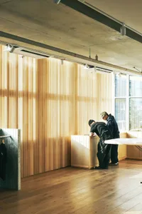 A modern retail storefront with wooden accents and an open, airy design.