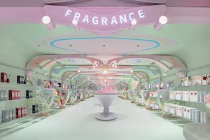 Modern retail store with a pastel color palette featuring fragrances