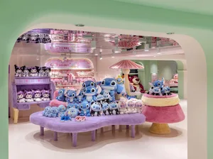 A toy shop filled with various plush toys and stuffed animals displayed on tables and shelves.