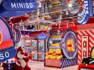 A colorful and playful retail store interior featuring various plush toys and decorative elements.