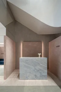 Concrete storefront with minimalist design and modern stonework.