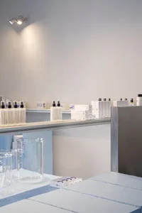 A laboratory scene featuring minimalist design with glass containers and equipment.